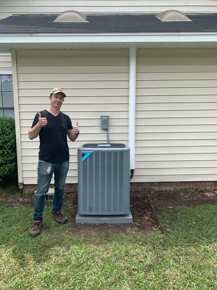 A Holy City technician talking with a happy customer at their Charleston home